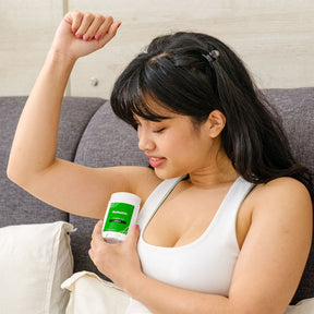 woman applying nateskin natural deodorant on her armpit